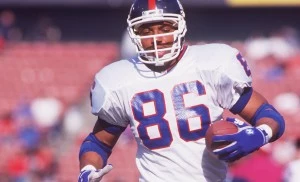 15 Feb 1995: TIGHT END DEREK BROWN OF THE NEW YORK GIANTS RUNS DOWN THE SIDELINE DURING their GAME AGAINST THE SAN FRANCISCO 49ERS AT CANDLESTICK PARK IN SAN FRANCISCO, CALIFORNIA.